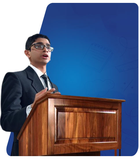 A Hejaaz student speaking at a lectern